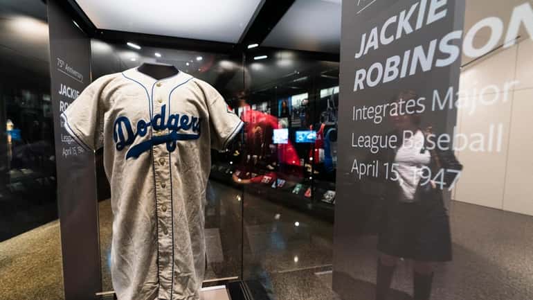 A jersey of Jackie Robinson is displayed at the National...