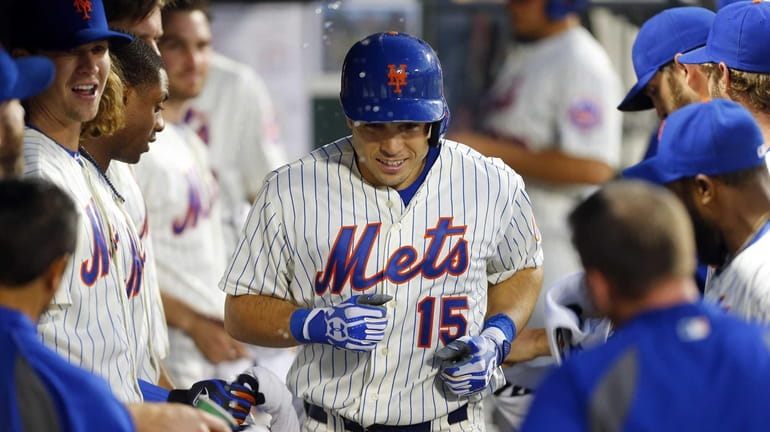 Travis d'Arnaud of the Mets celebrates his fourth-inning home run...