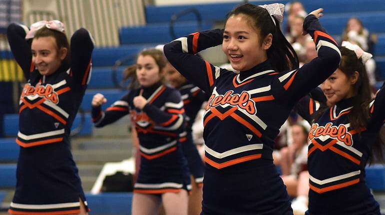 The Great Neck South cheerleading team performs during a Nassau...