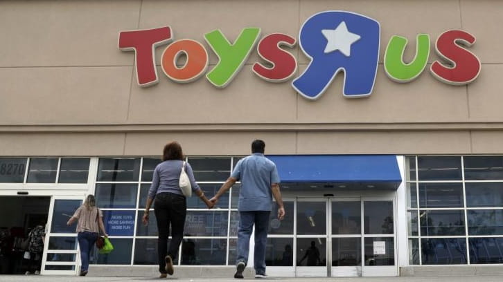 Shoppers walk into a Toys R Us store in San...
