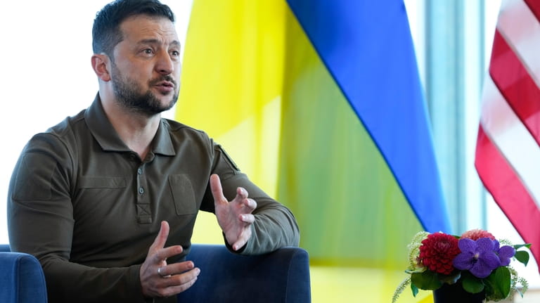 Ukrainian President Volodymyr Zelenskyy gestures during a meeting with President...