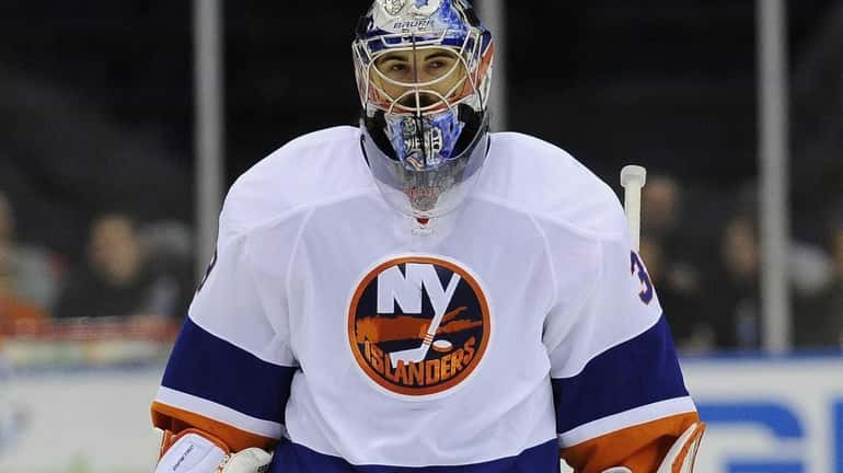 Islanders' Rick DiPietro is seen on the ice during the...