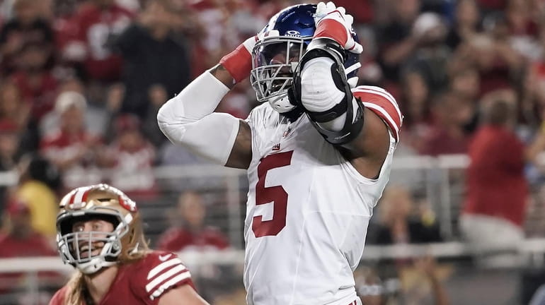 Giants linebacker Kayvon Thibodeaux reacts after being called for a...