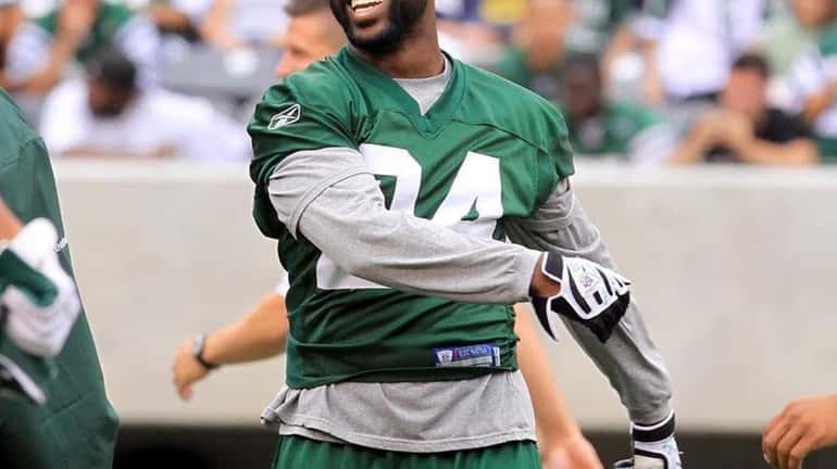 Jets cornerback Darrelle Revis smiles during a workout at the...