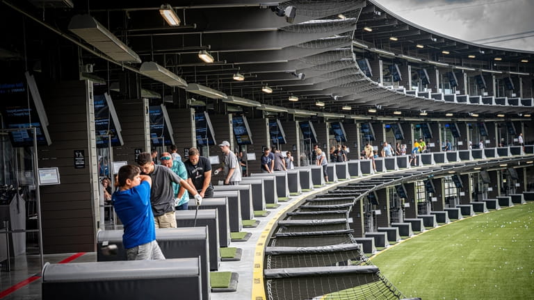 Top Golf in Holtsville features heated bays for outdoor play. 