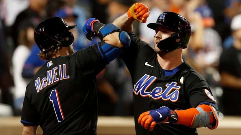 Pete Alonso of the Mets celebrates his sixth-inning home run against the...