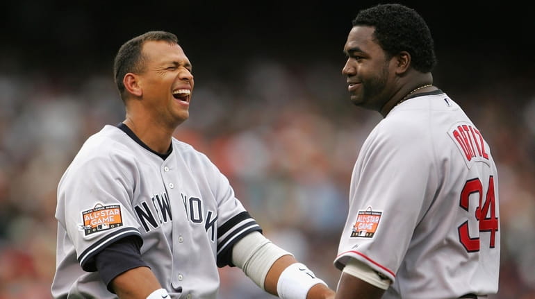Alex Rodriguez of the Yankees laughs with David Ortiz of...