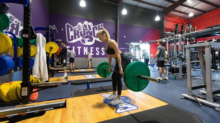 Amanda Pusateri of Massapequa lifts weights at Crunch Fitness in...
