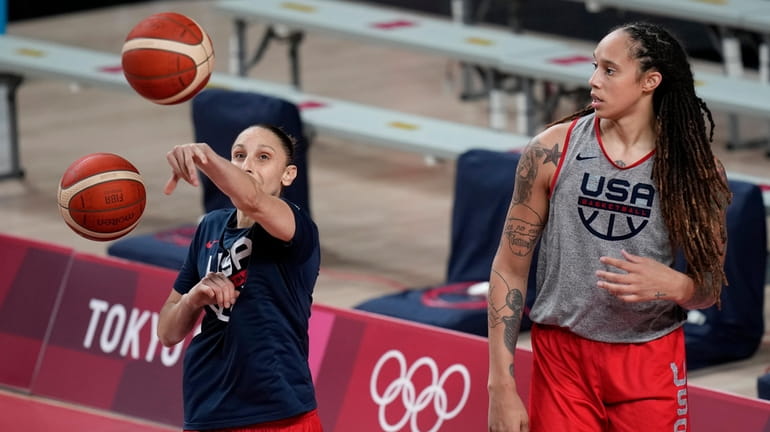 FILE - United States' Diana Taurasi, left, and Brittney Griner...