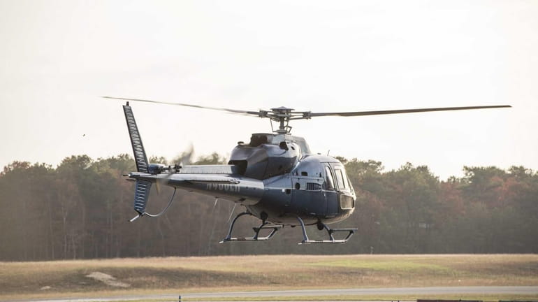 A helicopter departs from the East Hampton Town Airport in...