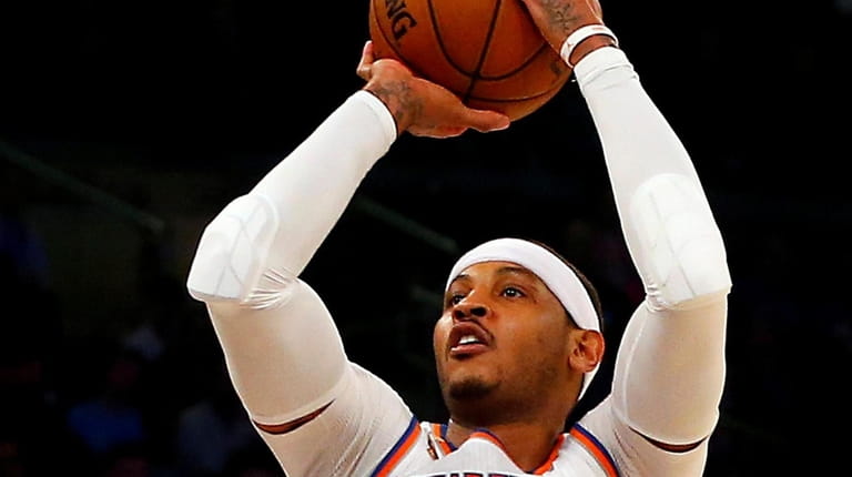 Carmelo Anthony #7 of the New York Knicks puts up...