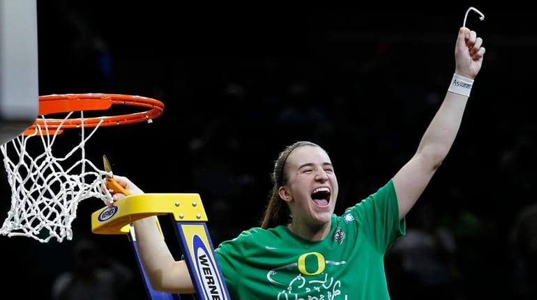 Oregon guard Sabrina Ionescu celebrates a regional final victory over...