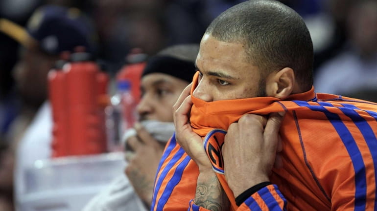 Knicks center Tyson Chandler watches from the bench during the...