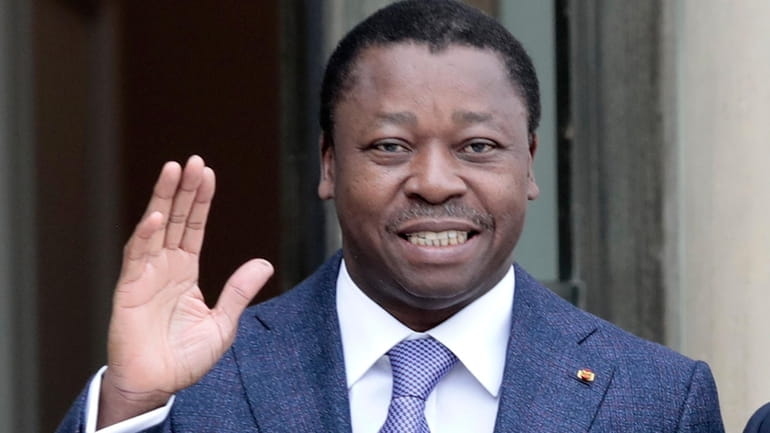 Togo's President Faure Gnassingbe waves before a working lunch at...