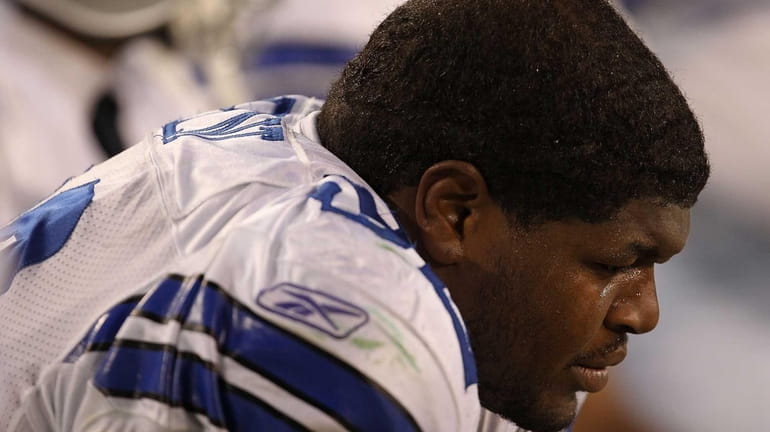 Dallas Cowboys defensive tackle Josh Brent sits on the bench...