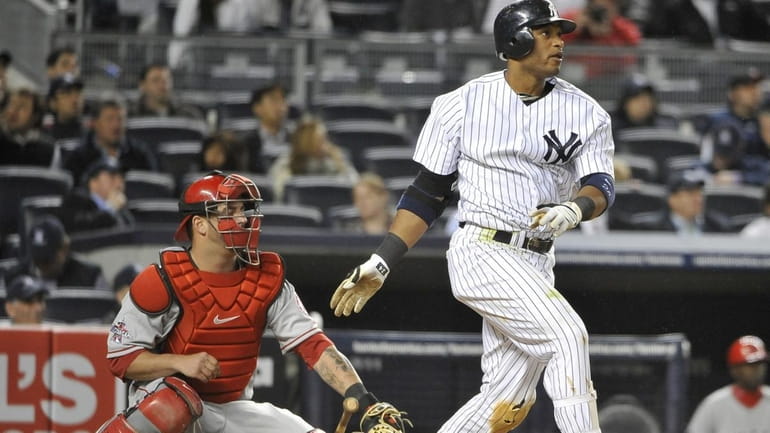 Yankees Robinson Cano hits a two run home run in...