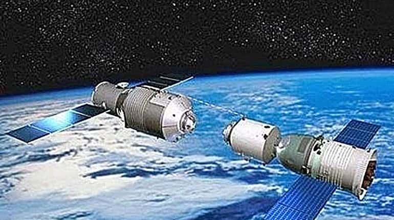 The Tiangong-1 space station, left, will soon begin falling to...