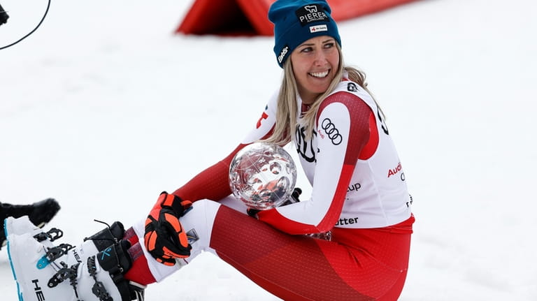 Austria's Cornelia Huetter holds the women's World Cup downhill discipline...