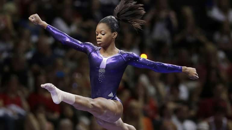 Gabby Douglas competes in the floor exercise event during the...