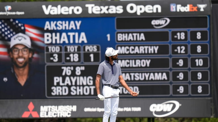 Akshay Bhatia reacts after his shot on the ninth hole...
