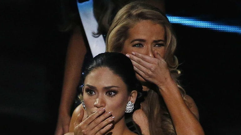 Miss Philippines Pia Alonzo Wurtzbach, front, reacts after she was...