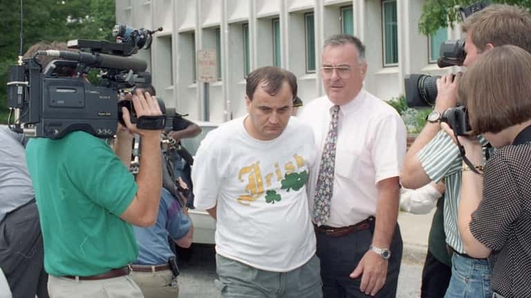 John Ford of Bellport on the way to his arraignment...