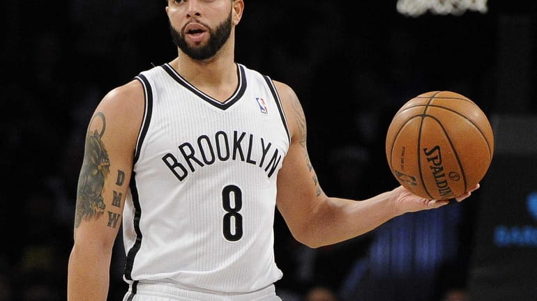 Nets guard Deron Williams controls the ball against the Cleveland...