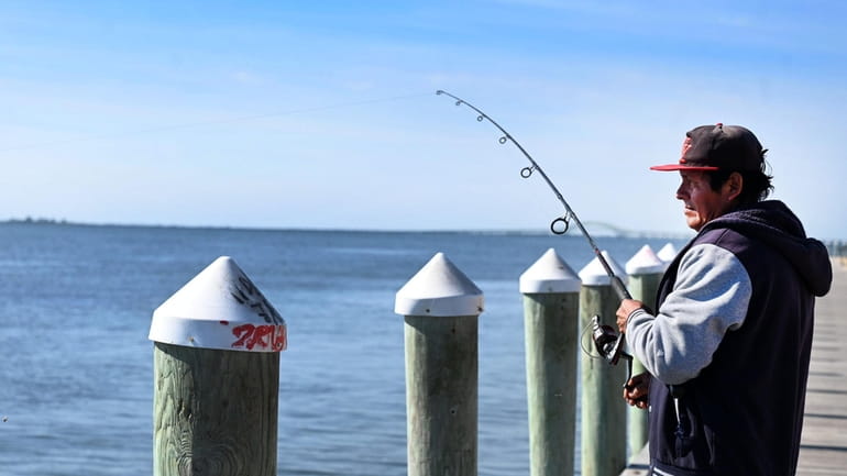 Julio Reyes of Bay Shore, had a bountiful morning; catching...