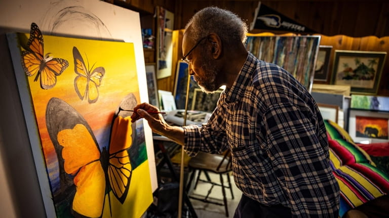Artist Aaron Scott working in his home studio in Freeport.