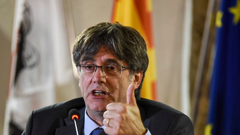 Catalan leader Carles Puigdemont speaks at a press conference in...