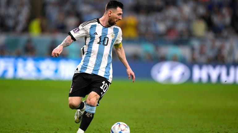 Argentina's Lionel Messi dribbles the ball during the World Cup...