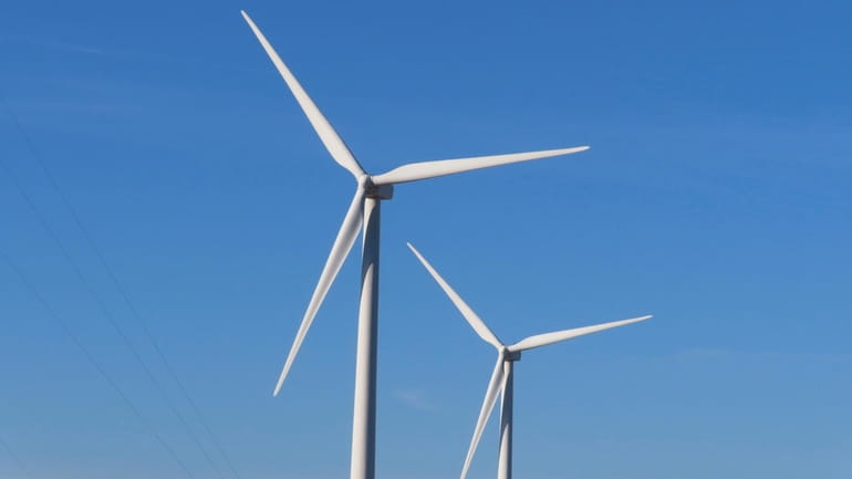 Land-based wind turbines spin in Atlantic City. N.J. on Nov....