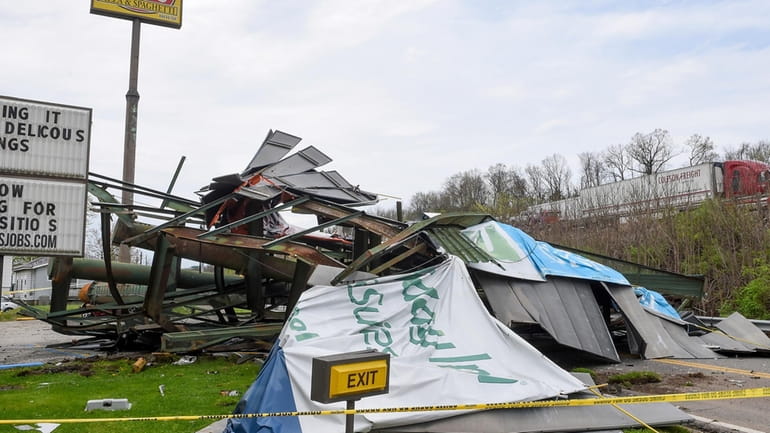 A steel billboard and its support were blown over in...