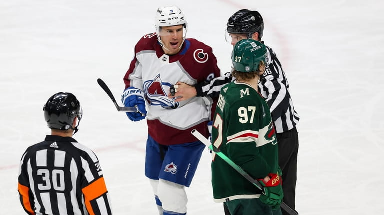 Colorado Avalanche left wing Zach Parise (9) exchanges words with...