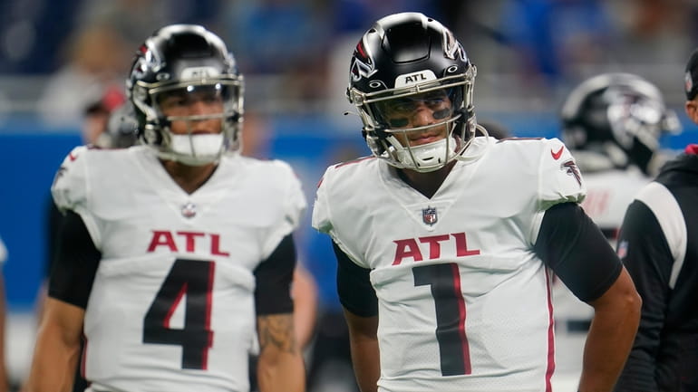 FILE - Atlanta Falcons quarterbacks Marcus Mariota (1) and Desmond...
