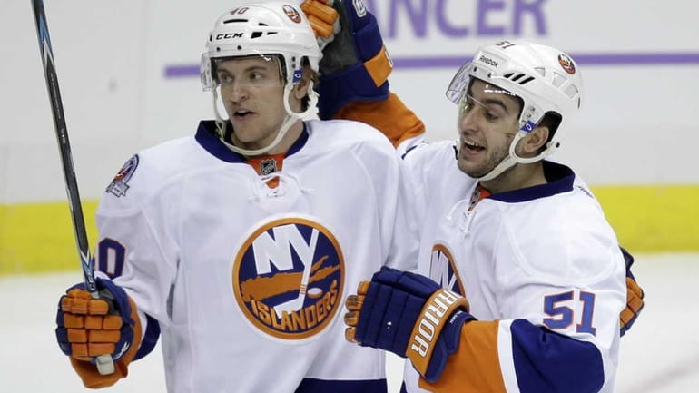 New York Islanders' Frans Nielsen (51) celebrates his goal with...