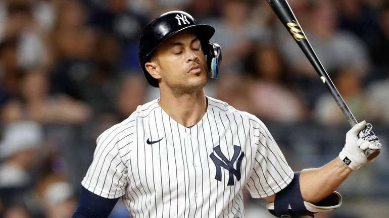 Giancarlo Stanton of the Yankees strikes out to end the eighth...