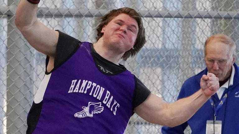 Quinn Smith of Hampton Bays competes the shot put at the New...