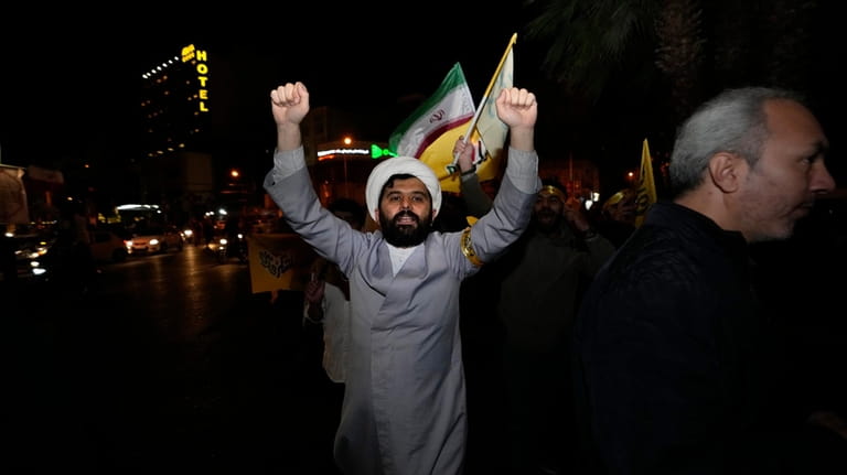 An Iranian cleric chants slogans while attending an anti-Israeli gathering...