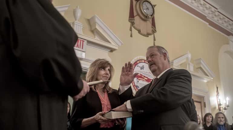 Freeport's new mayor, Robert Kennedy, is sworn in at a...