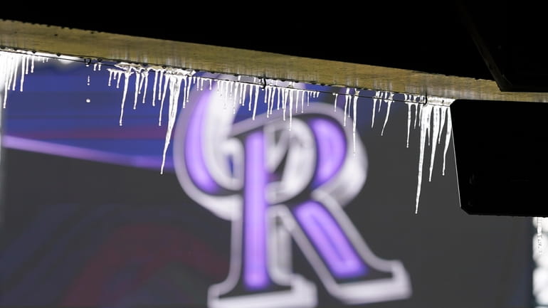 Icicles hang down from the upper deck of Coors Field...