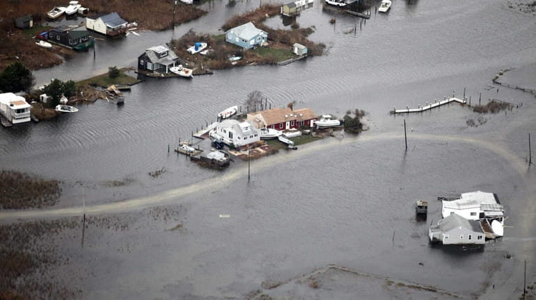 Flooding from superstorm Sandy damaged many homes on Long Island...