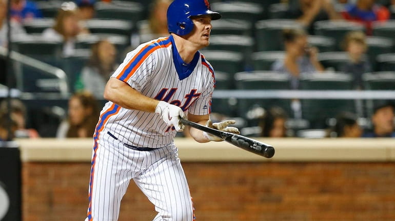 Jay Bruce #19 of the New York Mets follows through...