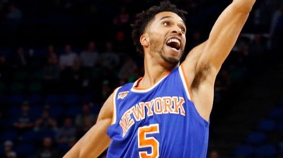 New York Knicks' Courtney Lee tries to thwart a shot...
