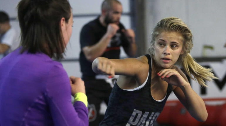 Aixed martial arts fighter Paige VanZant, right, spars with Sarah...