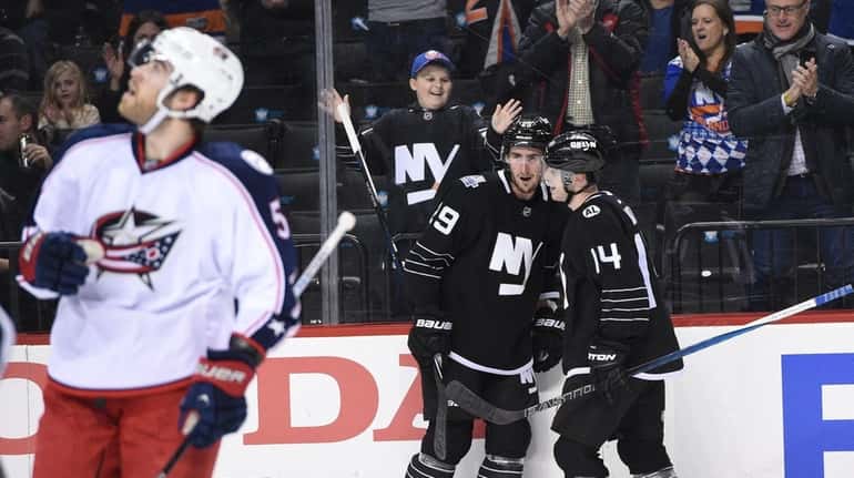 New York Islanders left wing Brock Nelson celebrates his goal...