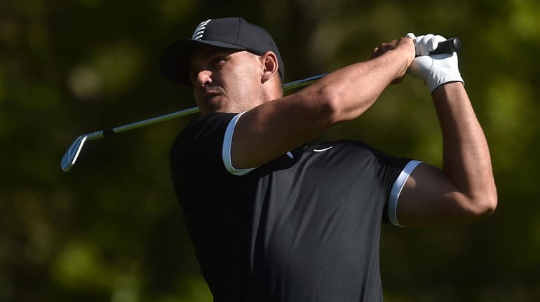 Brooks Koepka tees off on Hole 8 during the third...