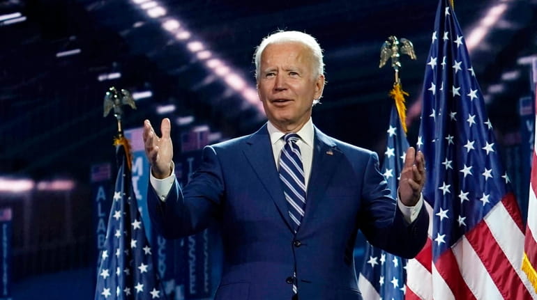 Former Vice President Joe Biden stands on stage on the third...
