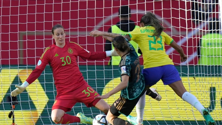Germany's goalkeeper Ann-Katrin Berger saves a shot by Brazil's Gabriela...