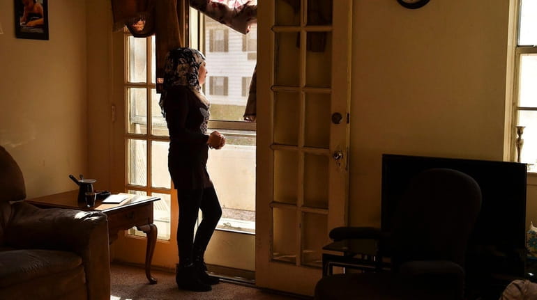 Linda J., a Syrian refugee, at her Baltimore apartment in...
